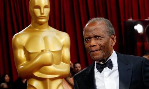 Presenter and actor Sidney Poitier arrives at the 86th Academy Awards in Hollywood, California.