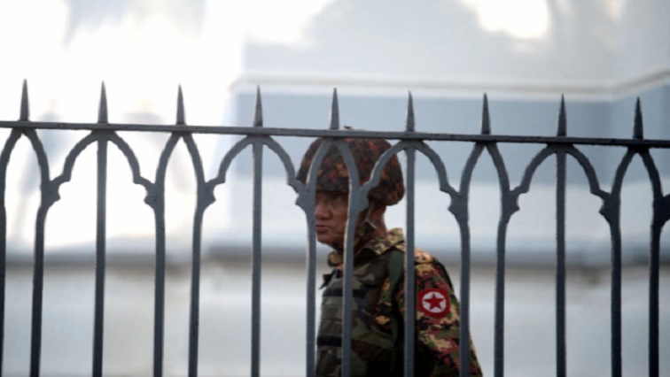 A Myanmar soldier looks on as he stands inside city hall after soldiers occupied the building, in Yangon, Myanmar February 2, 2021.