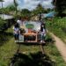 Student volunteers ride on their makeshift trolley which serves as a mobile library for children, in Tagkawayan, Quezon Province, Philippines, February 15, 2022.