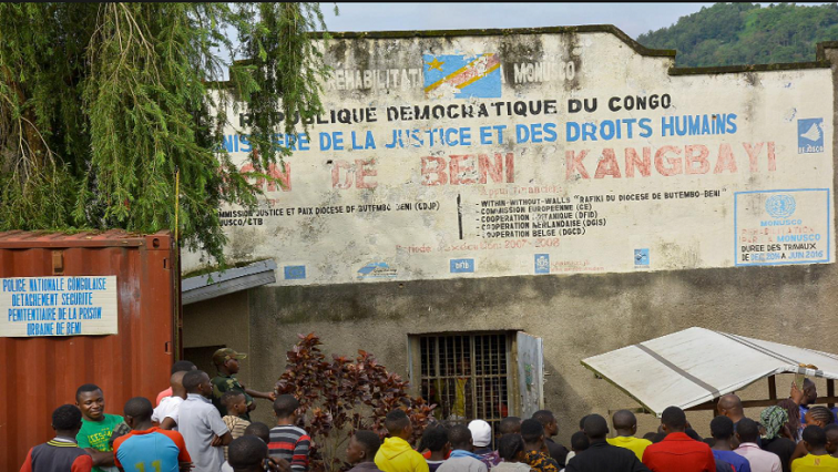 [File photo] Civilians stand outside the Kangbayi central prison in Beni, Democratic Republic of Congo, October 20, 2020.