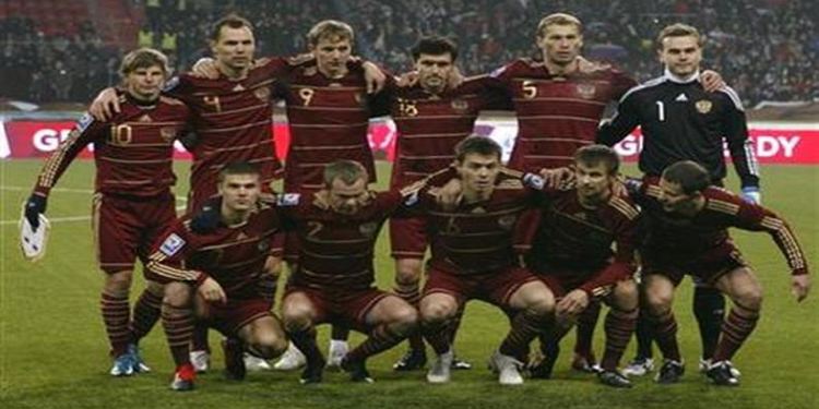 Russia's soccer team pose before the first leg of their 2010 World Cup qualifying soccer match against Slovenia in Moscow.