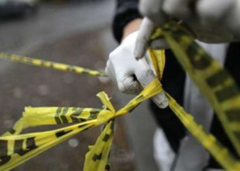 [File photo] Police tape cordons off a crime scene.