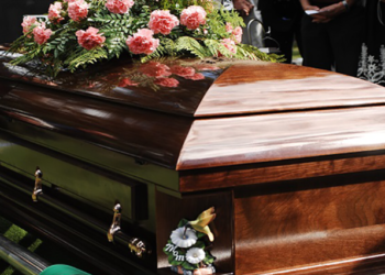 [File photo] A wooden coffin in seen in the image above.