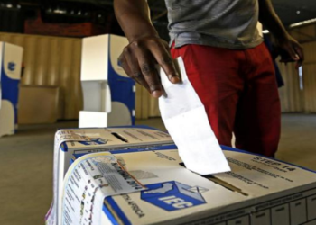 A man casts his vote during elections in SA.