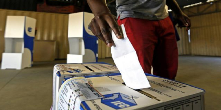 A man casts his vote during elections in SA.