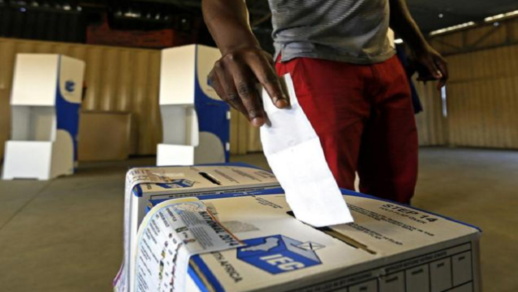 A man casts his vote during elections in SA