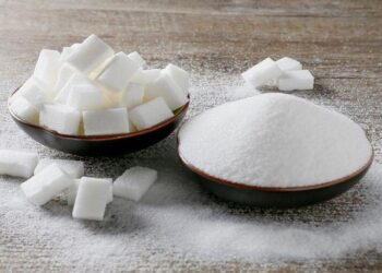 Granulated white sugar and sugar cubes are seen in this picture illustration.