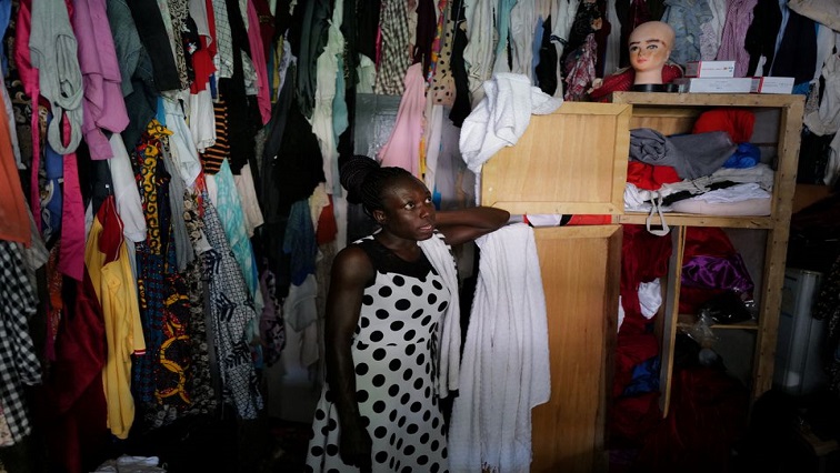 Va-Bene Elikem Fiatsi, 40, a trans woman who is an artist and LGBT+ activist, stands inside her wardrobe at her home and studio in Oduom, Ashanti Region-Ghana, December 22, 2021.