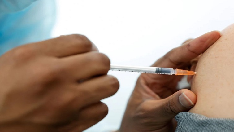 A medical staff administers the Pfizer-BioNTech COVID-19 vaccine to a woman at a coronavirus disease (COVID-19) vaccination center in Neuilly-sur-Seine, France, February 19, 2021.