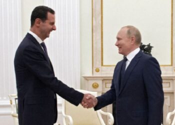 Russian President Vladimir Putin shakes hands with Syrian President Bashar al-Assad during a meeting at the Kremlin in Moscow, Russia, September 13, 2021.