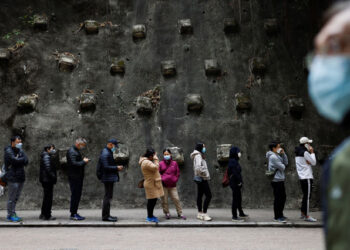 People queue up at a community testing centre for the coronavirus disease (COVID-19), in Hong Kong, China.