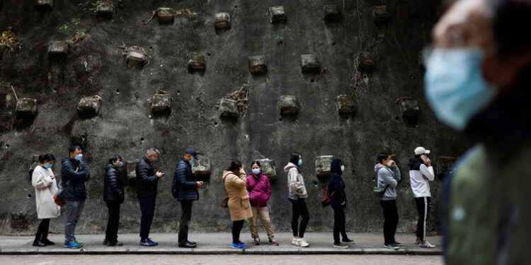 People queue up at a community testing centre for the coronavirus disease (COVID-19), in Hong Kong, China.