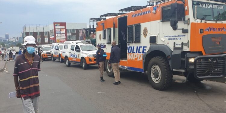 A large contingent of JMPD vans is seen in Alexandra, north of Johannesburg on 08 March 2022 amid clashes between locals and foreign nationals.