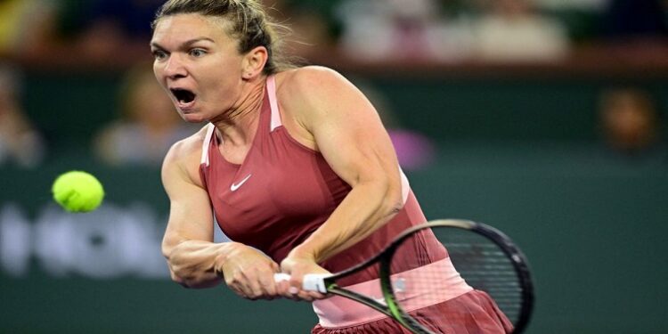 Simona Halep (ROM) hits a shot during her semifinal match against Iga Swiatek (ITA) during the BNP Paribas Open at the Indian Wells Tennis Garden.
