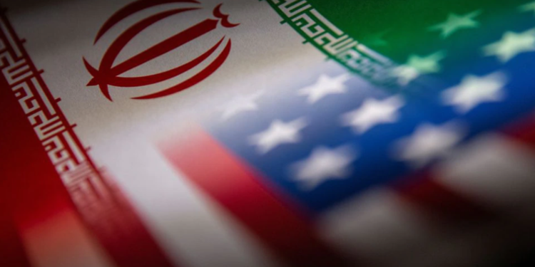 The flags of Iran and the US are seen printed on paper in this illustration taken January 27, 2022.