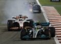 Bahrain Grand Prix - Bahrain International Circuit, Sakhir, Bahrain - March 20, 2022 Mercedes' Lewis Hamilton and Haas' Kevin Magnussen in action during the race