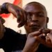 Ronald Ssegawa, 22, shows two fingers he partially lost during torture by people he alleges were security operatives, at the National Unity Platform offices in Kamwokya suburb of Kampala, Uganda March 21, 2022.