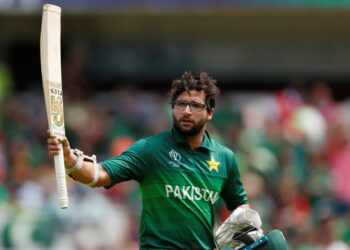 Pakistan's Imam-ul-Haq gestures to the crowd as he leaves the field after being dismissed soon after he scored his century, against Bangladesh at Lord's.
