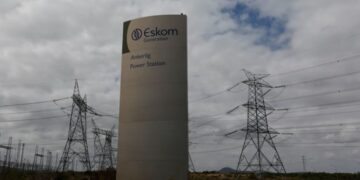 Pylons carry electricity from a sub-station of state power utility Eskom outside Cape Town.