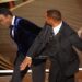 FILE PHOTO: Will Smith (R) hits Chris Rock as Rock spoke on stage during the 94th Academy Awards in Hollywood, Los Angeles, California, US.
