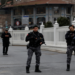 Members of the Turkish Presidential security team stand guard outside the Dolmabahce Presidential Working Office during the face-to-face talks between Ukrainian and Russian negotiators, in Istanbul, Turkey March 29, 2022.