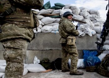 Ukrainian service members are seen at a check point in the city of Zhytomyr, Ukraine February 27, 2022.