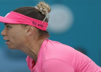 Vera Zvonareva wears a visor with the words "No War" scribbled on the side during her match against Danielle Collins (USA)(not pictured) in a third round women's singles match in the Miami Open at Hard Rock Stadium.