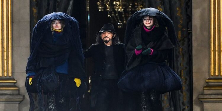 Designer Yohji Yamamoto appears on the stage with models after his Fall-Winter 2022/2023 Women's ready-to-wear collection show during Paris Fashion Week in Paris, France, March 4, 2022.