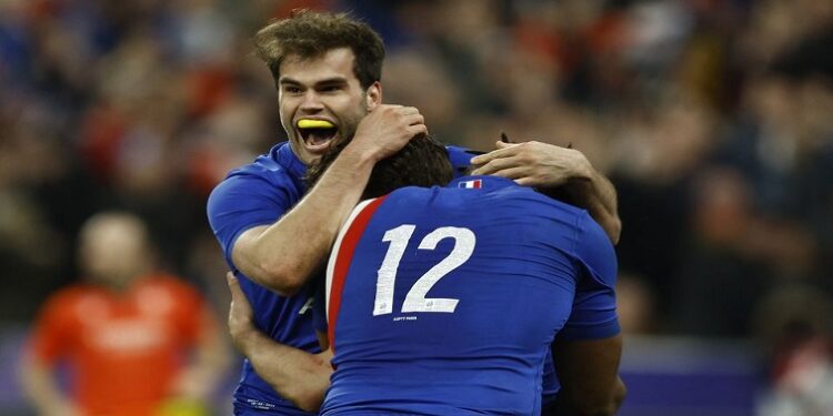 Six Nations Championship - France v England - Stade de France, Saint-Denis, France - March 19, 2022 France's Antoine Dupont celebrates scoring their third try with teammates