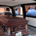 File image: A casket is seen inside a hearse.