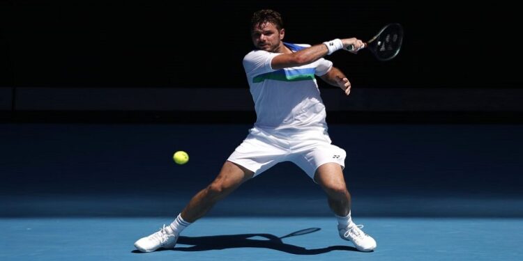 Switzerland's Stan Wawrinka in action during his second round match against Hungary's Marton Fucsovics at the Australian Open in Melbourne Park, Melbourne, Australia, February 10, 2021.