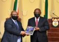 FILE PHOTO: Judge Raymond Zondo hands the State Capture report to President Cyril Ramaphosa.