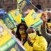 ANC supporters wave the party's flag at a manifesto launch in Pretoria, September 27, 2021.