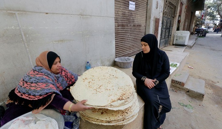 Nour El-Sabah, 35, sells traditional food during the holy month of Ramadan in Giza, Egypt