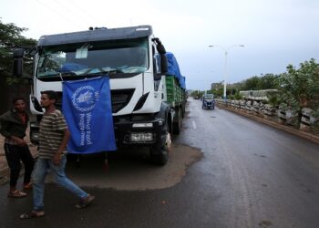 The World Food Program (WFP) convoy trucks carrying food items for the victims of Tigray war are seen parked after the checkpoints leading to Tigray Region were closed, in Mai Tsebri town, Ethiopia June 26, 2021.
