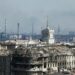 A view shows a plant of Azovstal Iron and Steel Works company behind buildings damaged in the course of Ukraine-Russia conflict in the southern port city of Mariupol, Ukraine April 7, 2022.