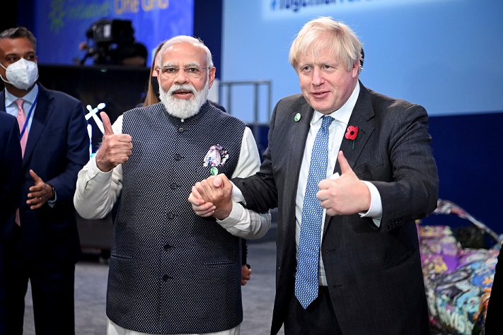 FILE PHOTO: Britain's Prime Minister Boris Johnson and India's Prime Minister Narendra Modi attend the "Accelerating Clean Technology Innovation and Deployment" session at the UN Climate Change Conference (COP26) in Glasgow, Scotland, Britain November 2, 2021.