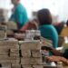 Workers count Myanmar's kyat banknotes at the office of a local bank in Yangon.