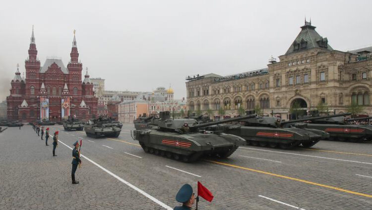 Russian servicemen drive T-14 tanks with the Armata universal combat platforms (front) during the Victory Day parade in Red Square in central Moscow, Russia.