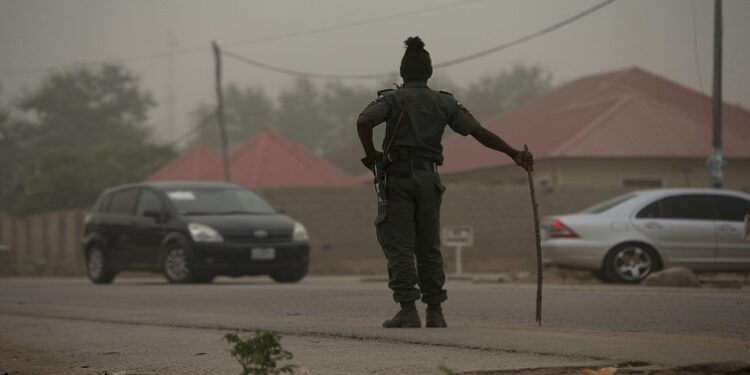 A policeman keeps watch on the road leading to Taraba state electoral commission [File image]