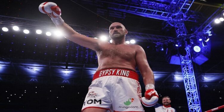 Tyson Fury celebrates winning his fight against Dillian Whyte.