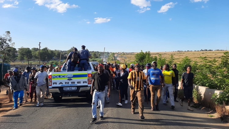 (File Image) A group of Diepsloot residents march towards Extension 1, where murders allegedly took place over the weekend prompting community protests in the area.