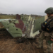 A military sapper inspects remains of a Russian Sukhoi Su-25 fighting aircraft hit by Ukrainian Armed Forces during Russia's invasion in Kyiv Region, Ukraine April 21, 2022. REUTERS/Mykola Tymchenko