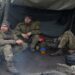Ukrainian servicemen rest at a military position, as Russia?s attack on Ukraine continues, in Kharkiv region, Ukraine April 20, 2022.