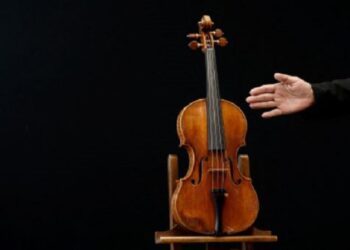 A rare 1736 violin by Italian luthier Guarneri del Gesu is displayed during a media preview at Aguttes auction house ahead of the violin's auction in Neuilly-sur-Seine, near Paris, France, April 26, 2022.