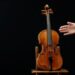A rare 1736 violin by Italian luthier Guarneri del Gesu is displayed during a media preview at Aguttes auction house ahead of the violin's auction in Neuilly-sur-Seine, near Paris, France, April 26, 2022.