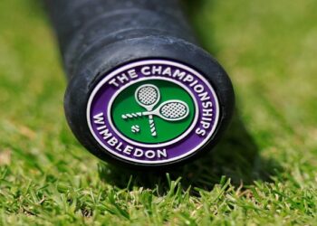 Wimbledon logo on the handle of a tennis racquet.