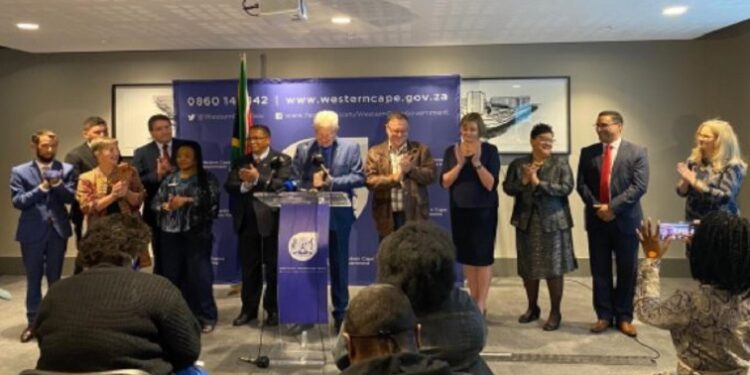 Western Cape Premier Alan Winde at the podium with some of the ministers.
