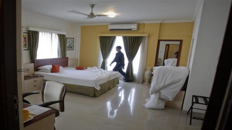 [File Image] A member of the housekeeping staff prepares a room at a hotel.