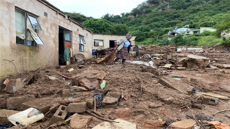 A woman in Mariannhill, West of Durban cleans her home after it was damaged by floods.